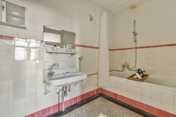 Interior of small bathroom with bathtub